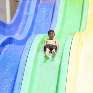 Exciting Rainbow Racing slide in water park